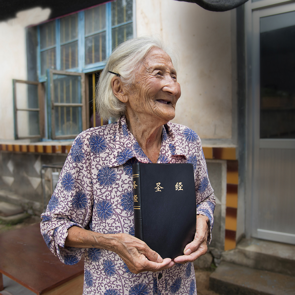 Elderly woman with Bible