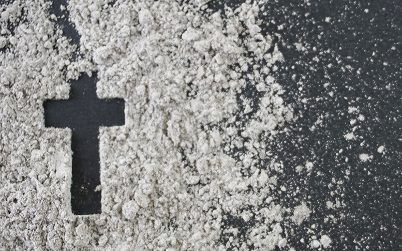 Cross or crucifix made of ash, Ash Wednesday conceptt Lent devotions